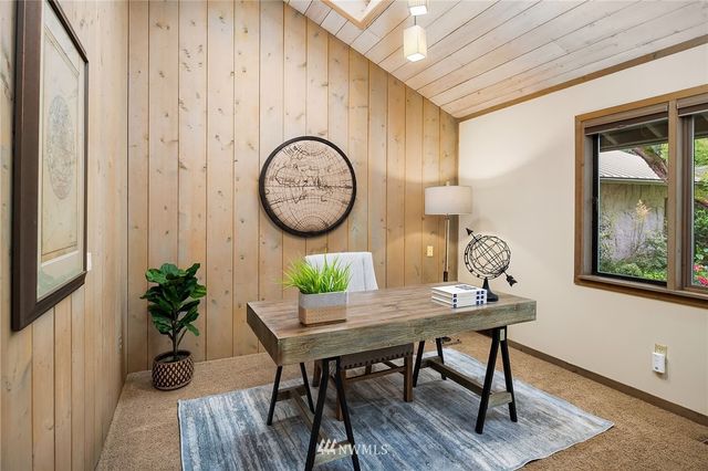 a workspace with furniture and wooden floor