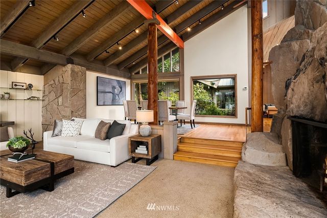 a outdoor living space with patio furniture and a fireplace