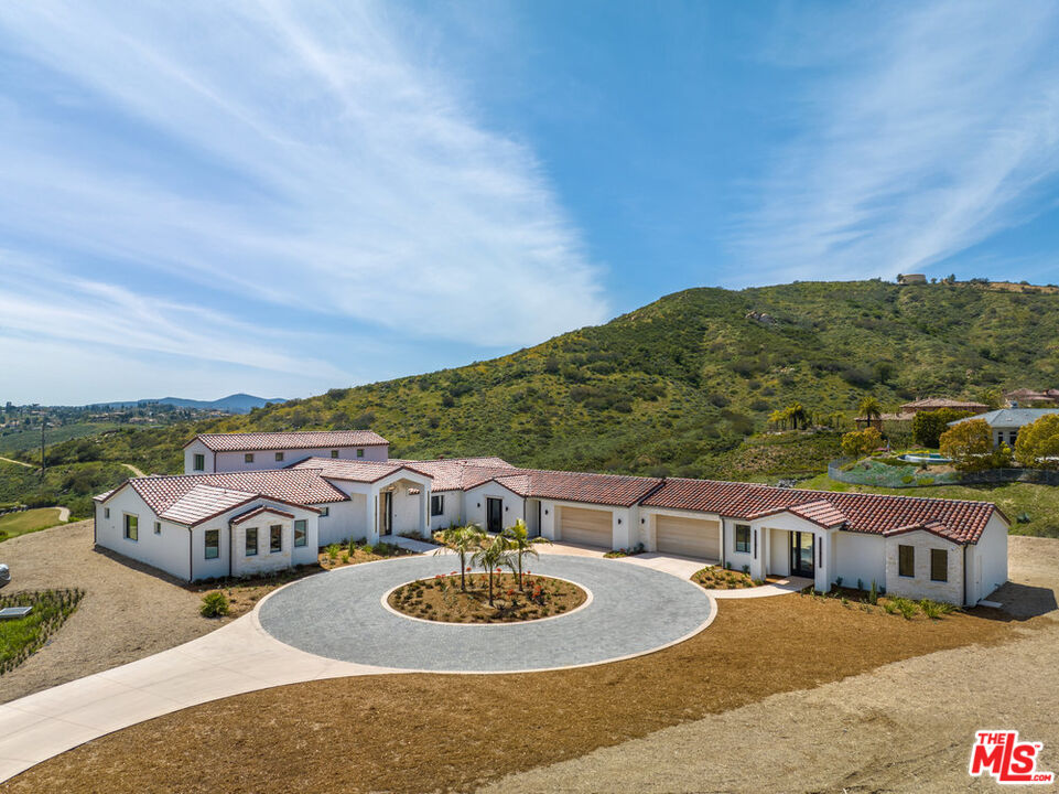 18711 Heritage Drive Poway, CA 92064 - Photo 1 of 1 a terrace with outdoor seating and city view