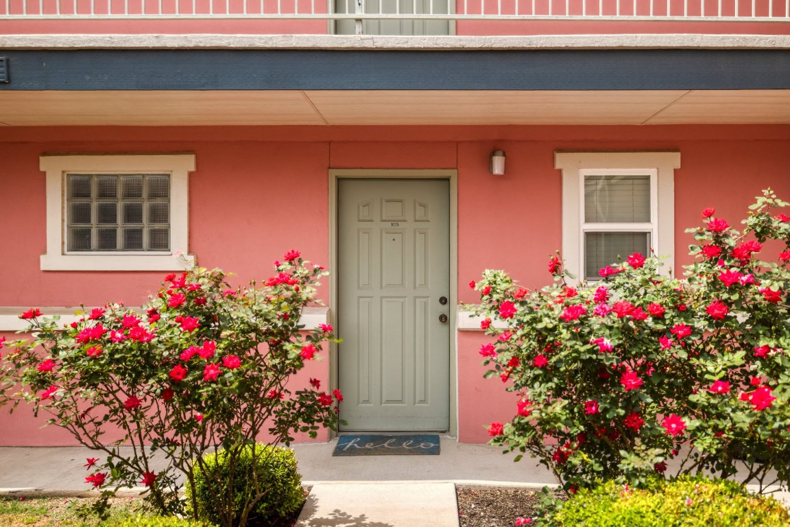 1422 Collier Street, Unit 105 Austin, TX 78704 - Photo 20 of 27 a view of a house with a lot of flower plants