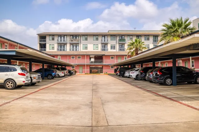 a view of a car park in front of a building