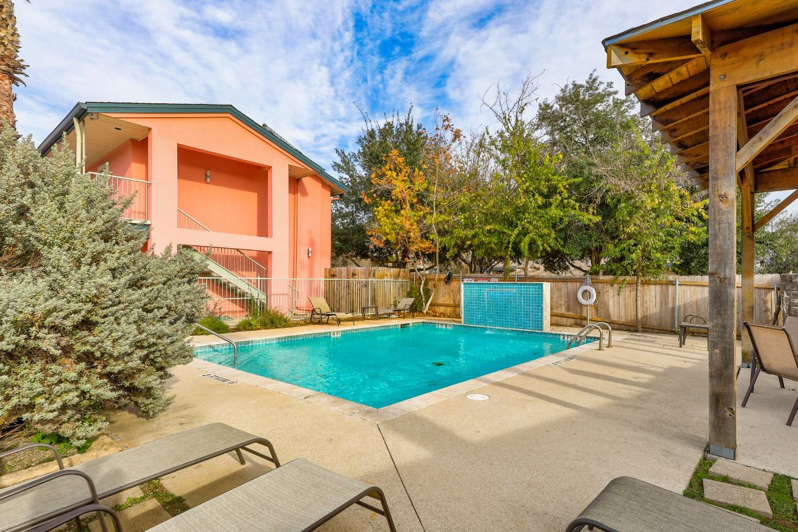 1422 Collier Street, Unit 105 Austin, TX 78704 - Photo 25 of 27 a front view of a house with garden