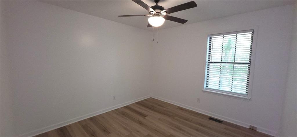 1774 Joe Black Road Sautee Nacoochee, GA 30571 - Photo 15 of 20 an empty room with a window and a fan