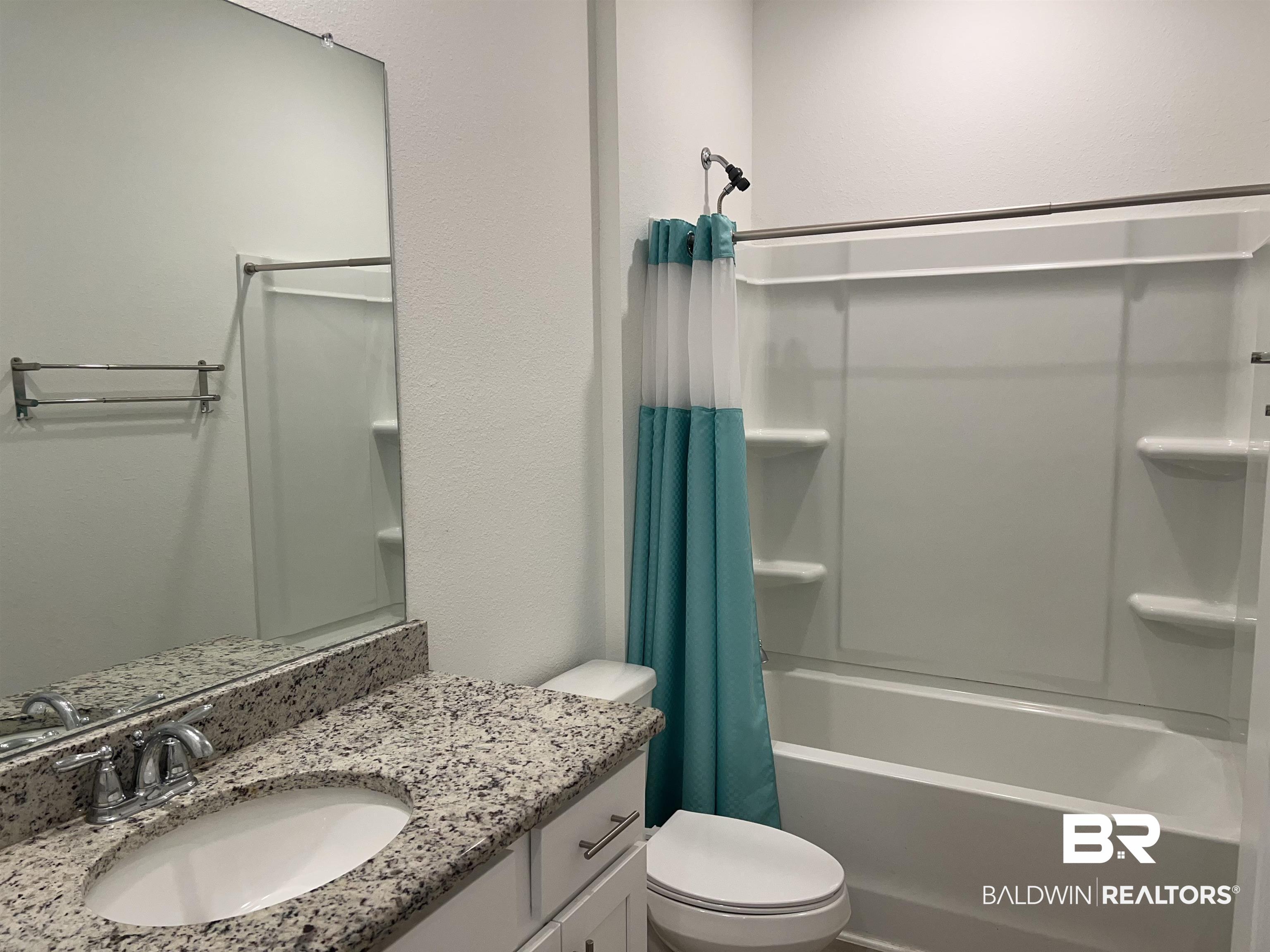 8855 Calverton Street Foley, AL 36535 - Photo 22 of 76 Full bathroom with shower / tub combo, vanity, and toilet