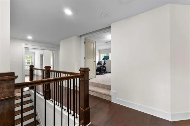 a view of a livingroom with furniture and hardwood floor