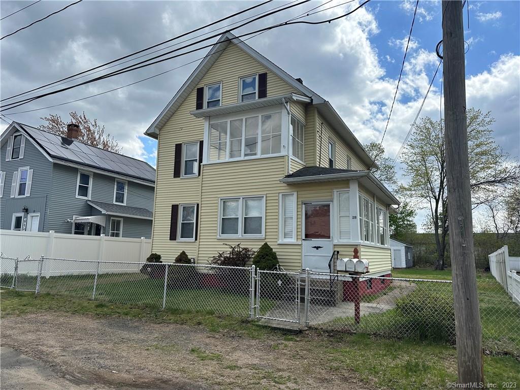 a view of a house with a yard