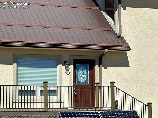 a living room with lots of furniture and wooden floor