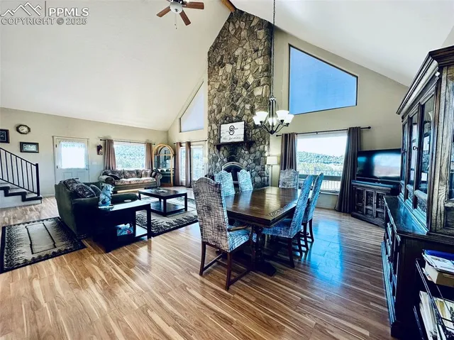 a bathroom with a granite countertop sink a mirror and a shower