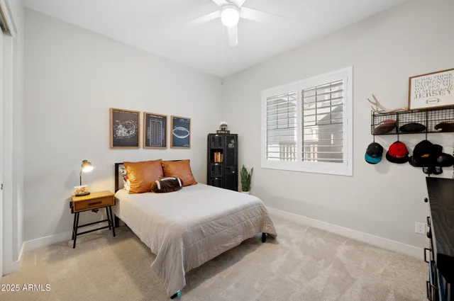 a bedroom with a bed dresser and a window