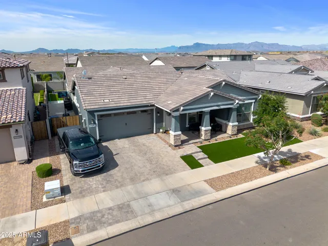 a front view of a house with porch and yard