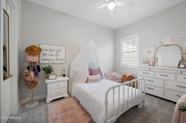 a bedroom with bed and window