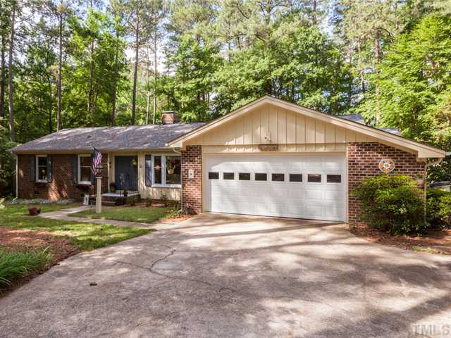 12601 Kristy Circle Raleigh, NC 27613 - Photo 2 of 25 a front view of a house with a garden