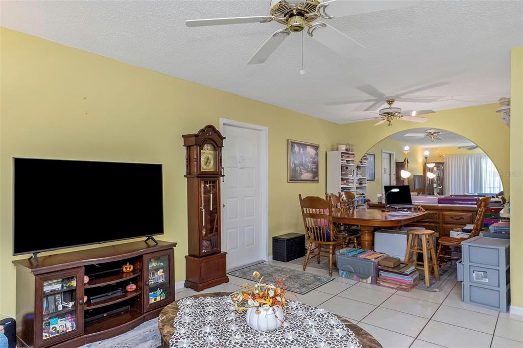 1344 Pine Ridge Circle East, Unit D2 Tarpon Springs, FL 34688 - Photo 11 of 44 a view of a livingroom with furniture and a flat screen tv