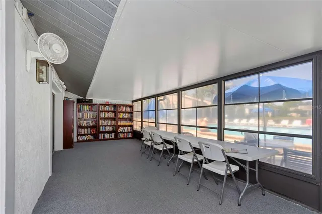 a view of a livingroom with furniture and a window