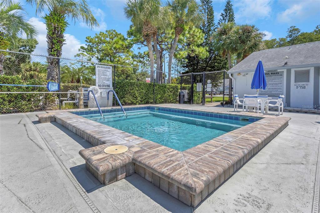 1344 Pine Ridge Circle East, Unit D2 Tarpon Springs, FL 34688 - Photo 27 of 44 a view of outdoor sitting space with furniture