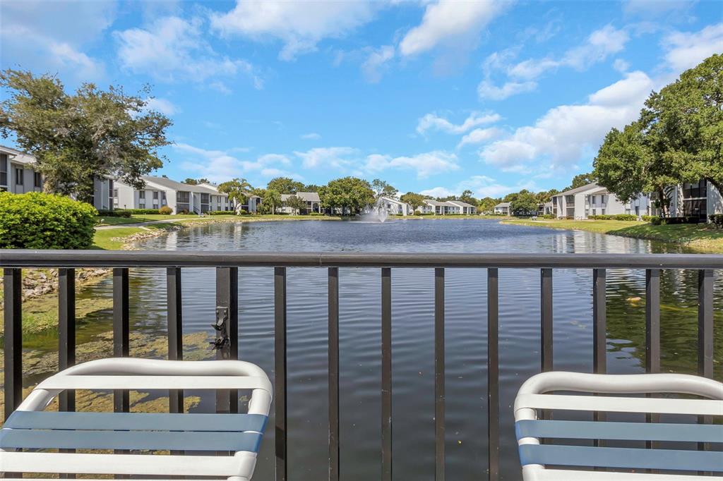 1344 Pine Ridge Circle East, Unit D2 Tarpon Springs, FL 34688 - Photo 30 of 44 a balcony with a city view