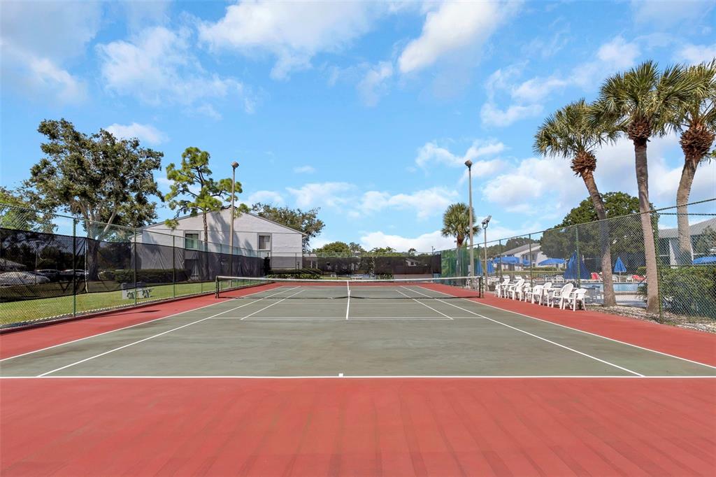 1344 Pine Ridge Circle East, Unit D2 Tarpon Springs, FL 34688 - Photo 33 of 44 a view of a tennis court