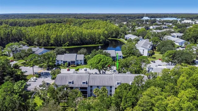 an aerial view of a house with a garden and plants