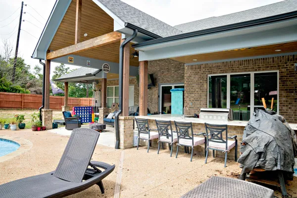 a open kitchen with stainless steel appliances granite countertop a sink and a stove