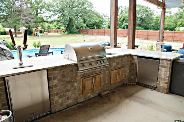 a view of outdoor space with playground and green space