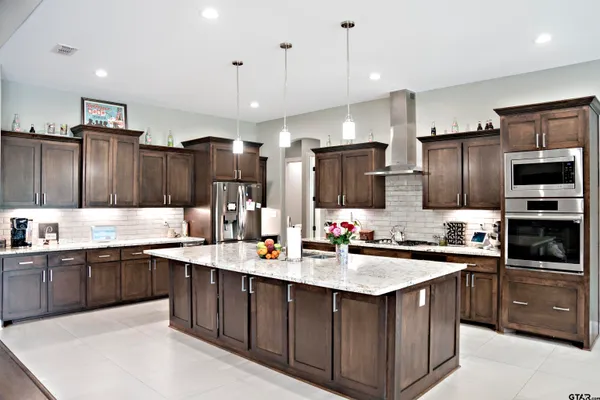 a kitchen with a stove and a cabinet
