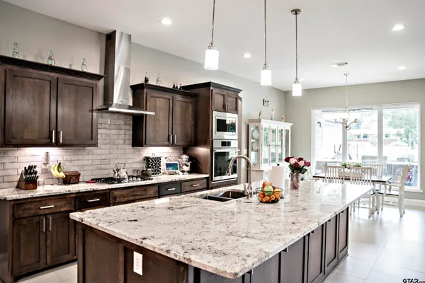 a bathroom with a sink toilet and mirror