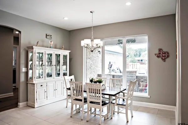 a bedroom with furniture and a wooden floor