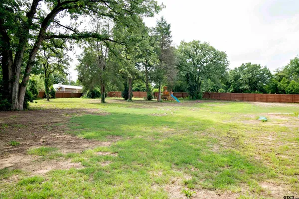a view of a house with swimming pool and porch