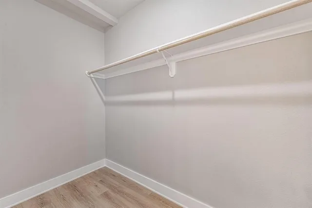 a bathroom with a sink toilet vanity and shower