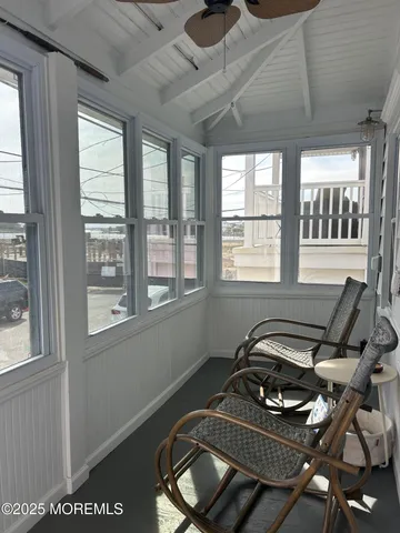 a picture of a room with furniture and windows