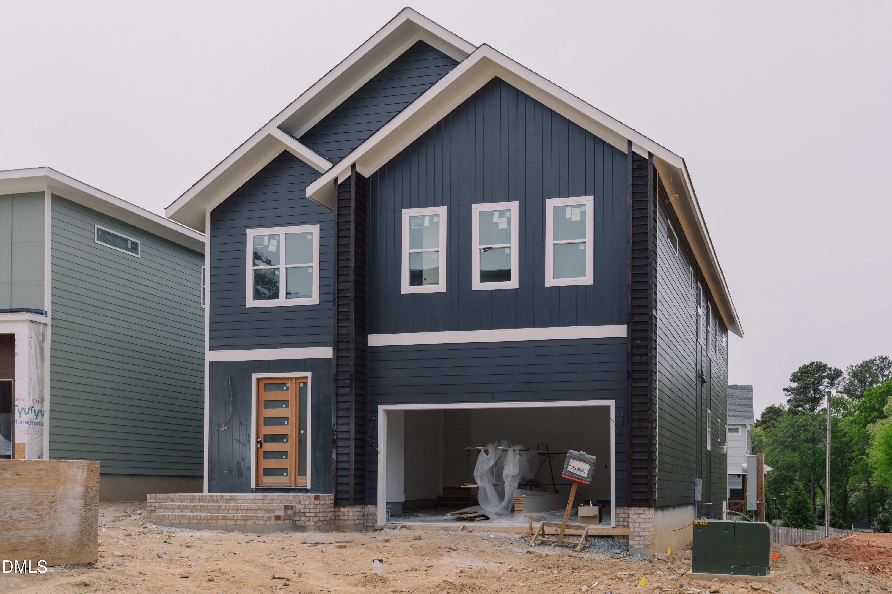 a front view of a house with yard