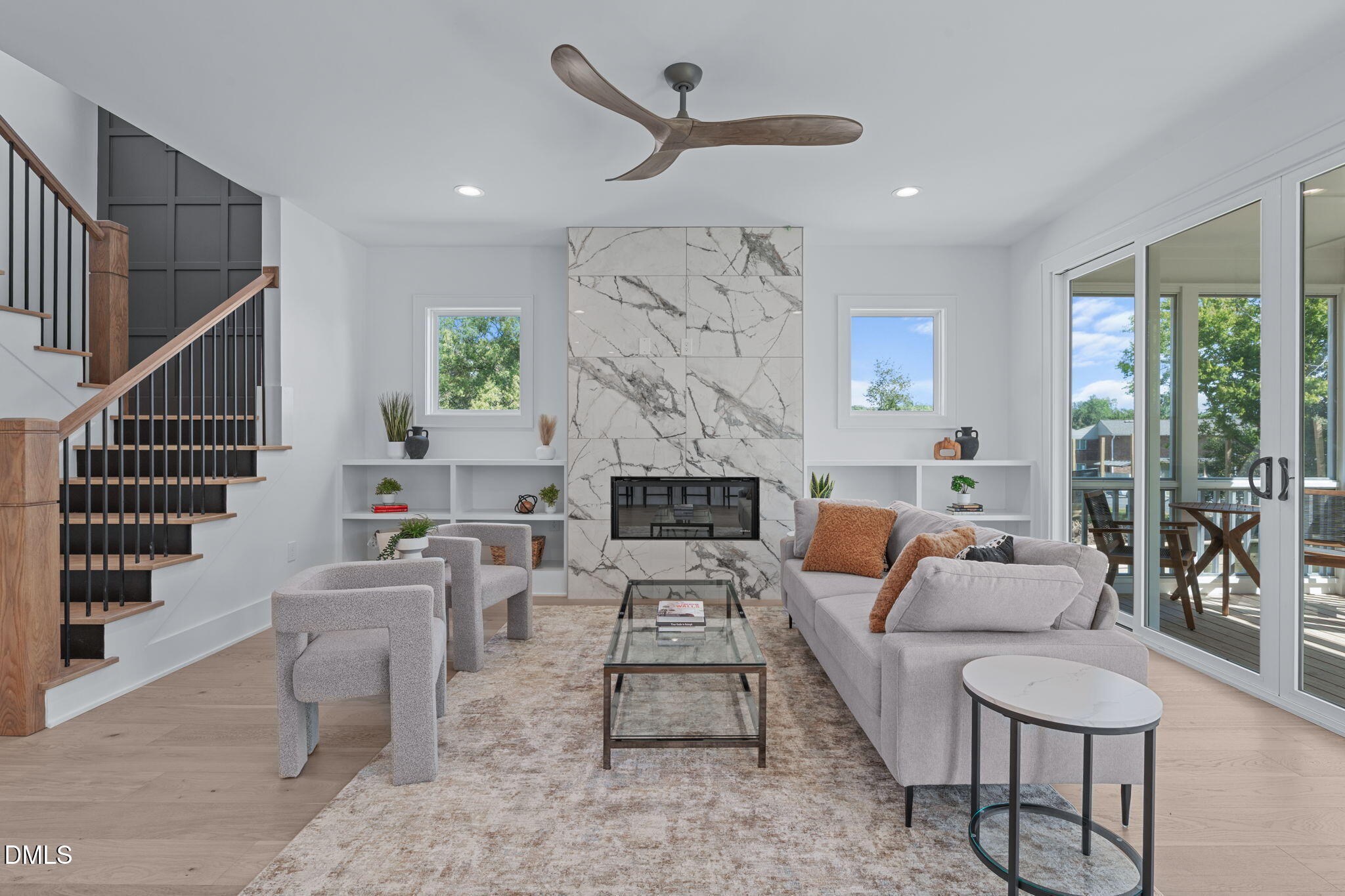 1005 Addison Place Raleigh, NC 27610 - Photo 17 of 47 a living room with furniture a fireplace and a chandelier