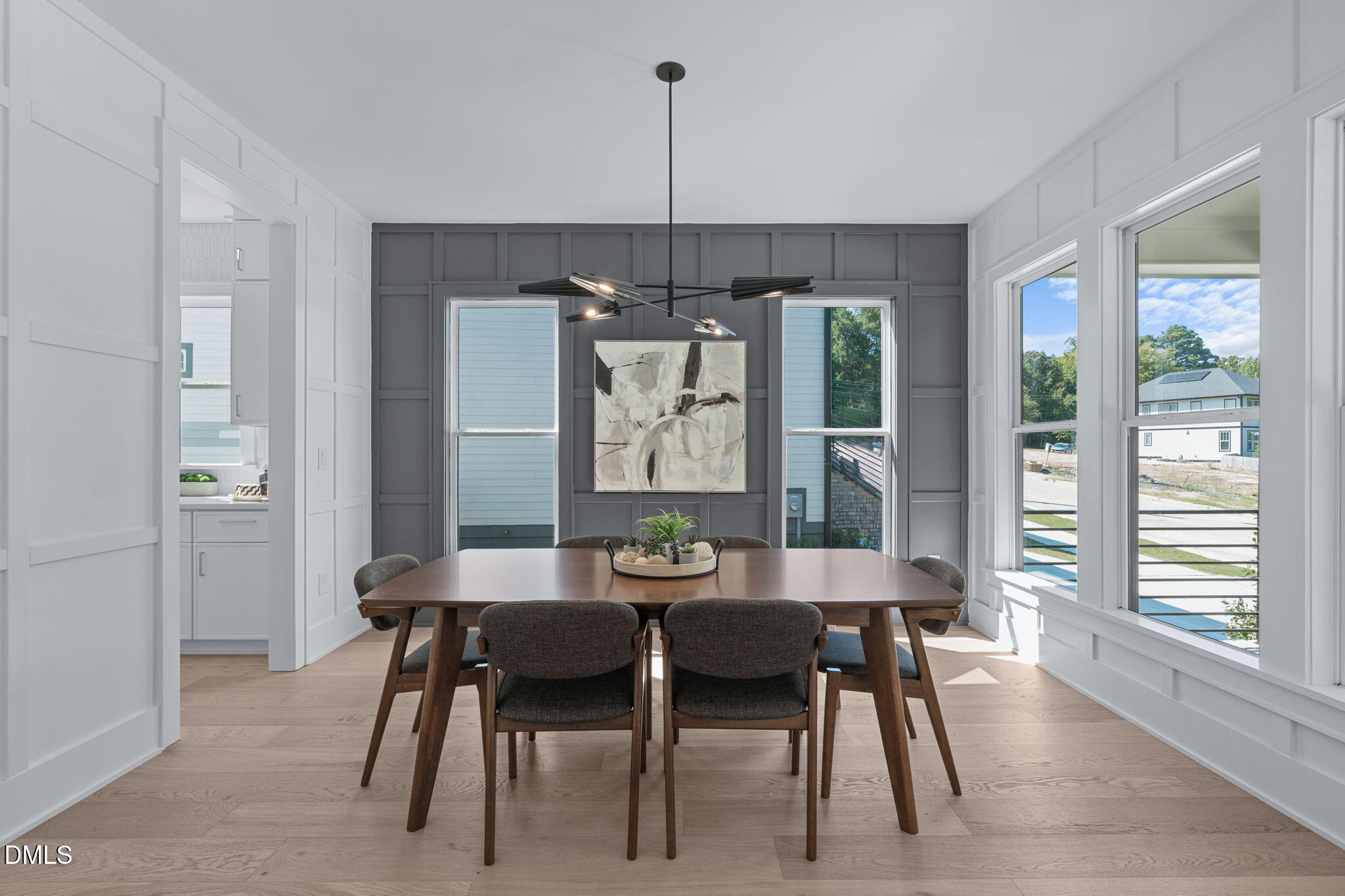 1005 Addison Place Raleigh, NC 27610 - Photo 24 of 47 a dining room with furniture a chandelier and wooden floor