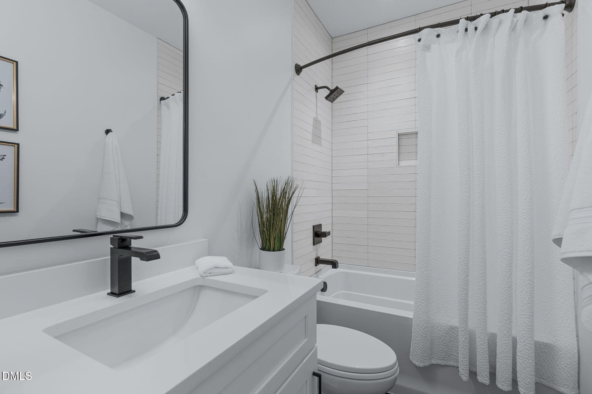 1005 Addison Place Raleigh, NC 27610 - Photo 27 of 47 a bathroom with a sink a toilet and shower