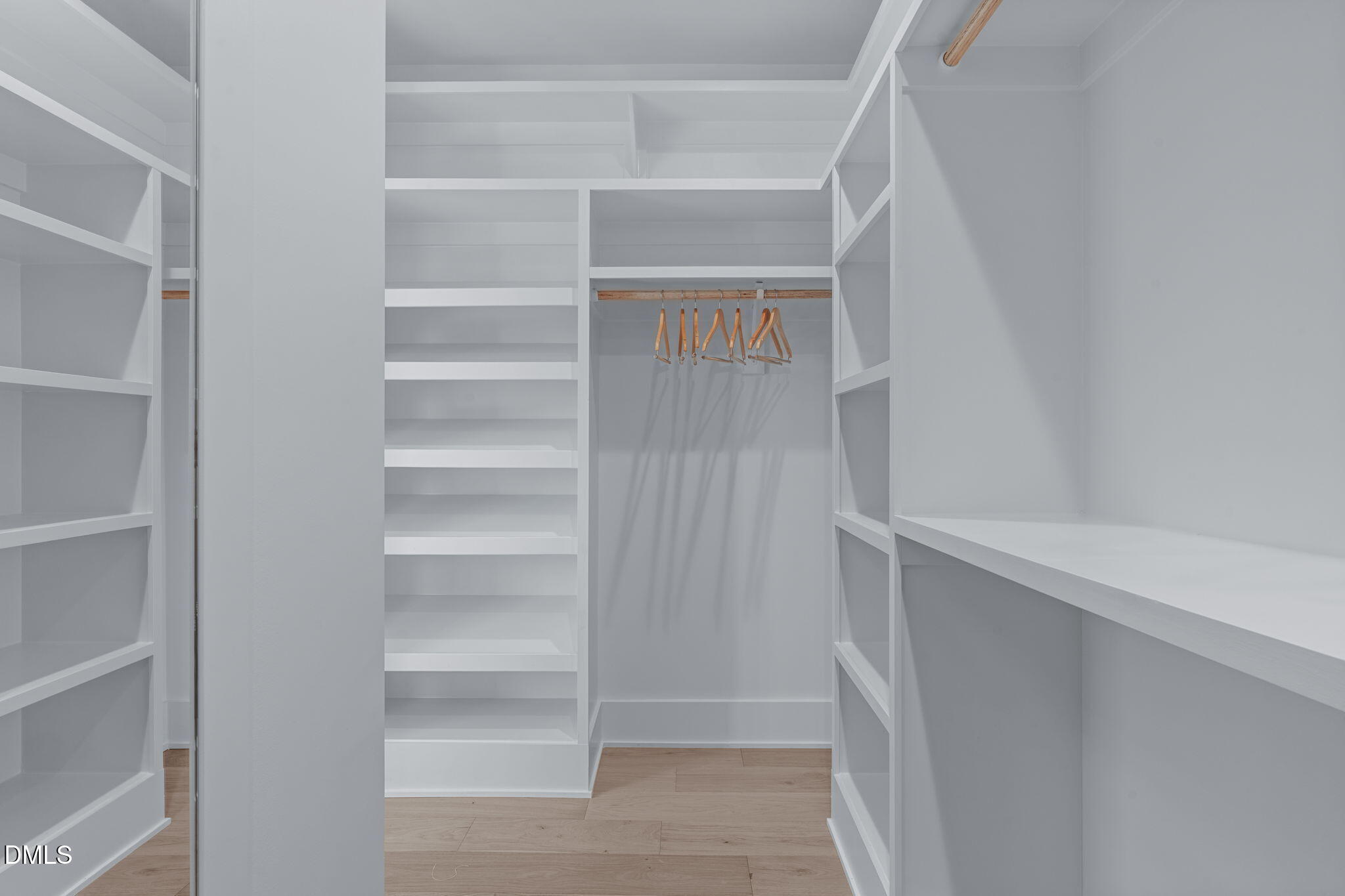 1005 Addison Place Raleigh, NC 27610 - Photo 28 of 42 a view of walk in closet with empty racks