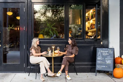 a view of a cafe with sitting area