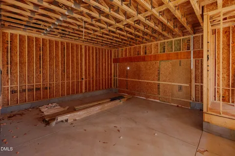 a view of an empty room with windows