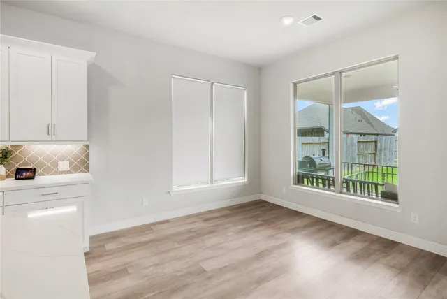 a view of walk in closet with clothes