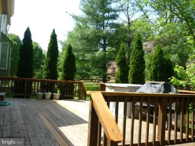 a view of balcony with wooden floor and outdoor seating