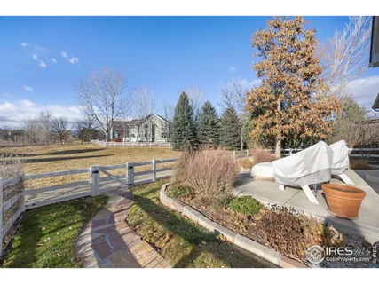 a view of a backyard of the house