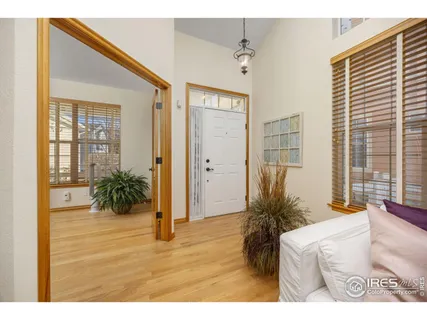 a bed room with a bed and a large window