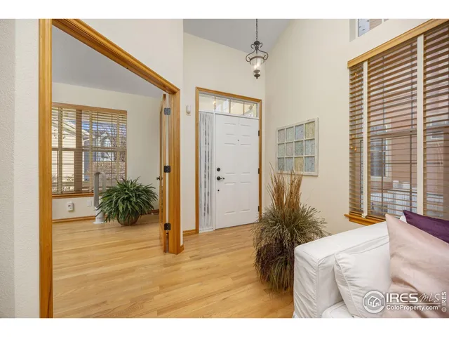 a bed room with a bed and a large window