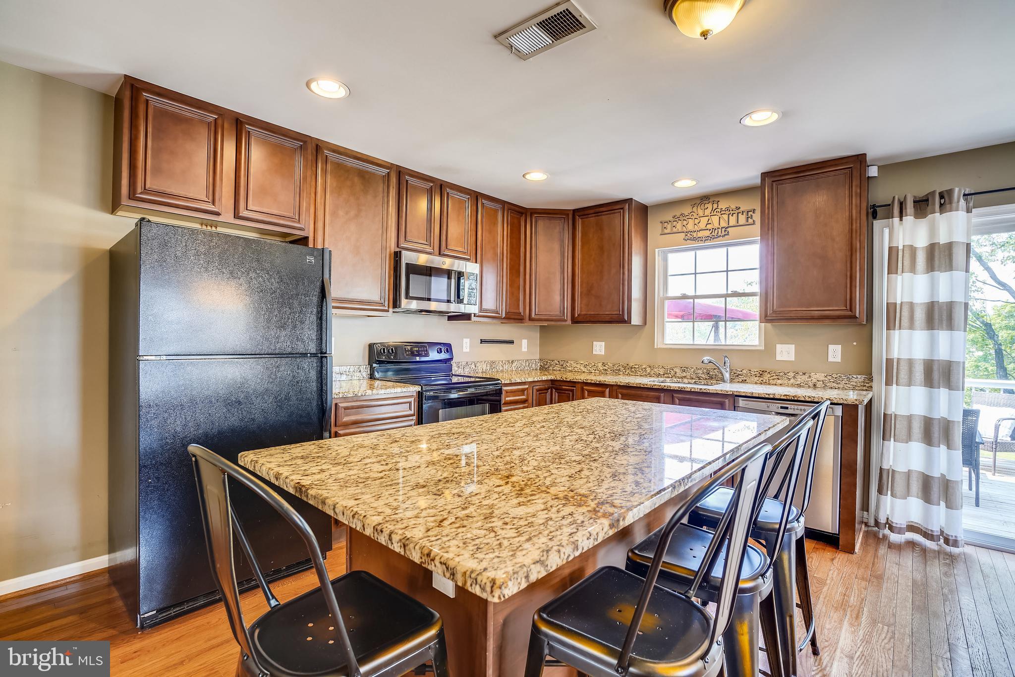134 Oakwood Road Edgewater, MD 21037 - Photo 4 of 33 enormous granite island with bar seating