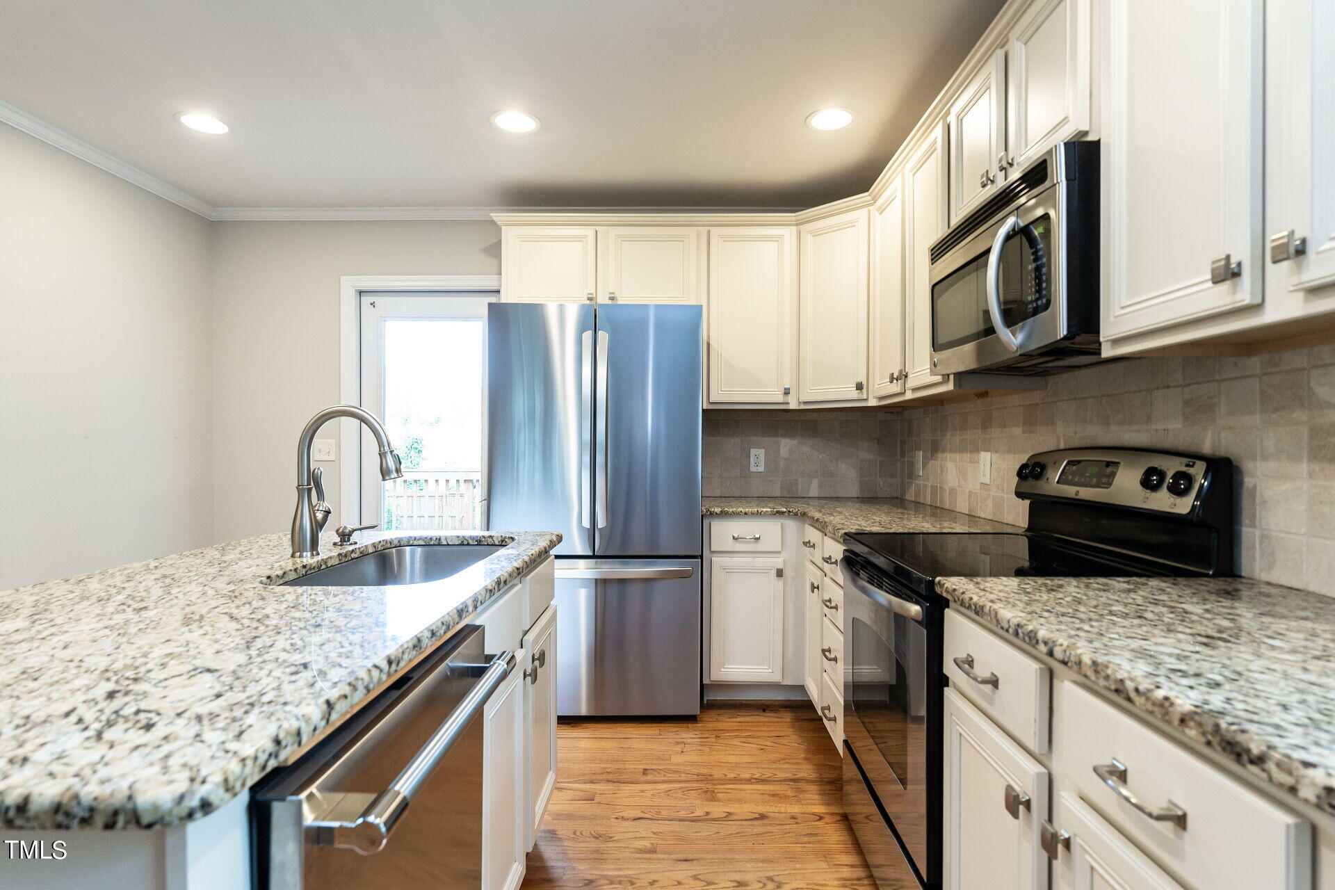 116 Plainview Avenue Raleigh, NC 27604 - Photo 19 of 35 a kitchen with stainless steel appliances granite countertop a sink stove and refrigerator