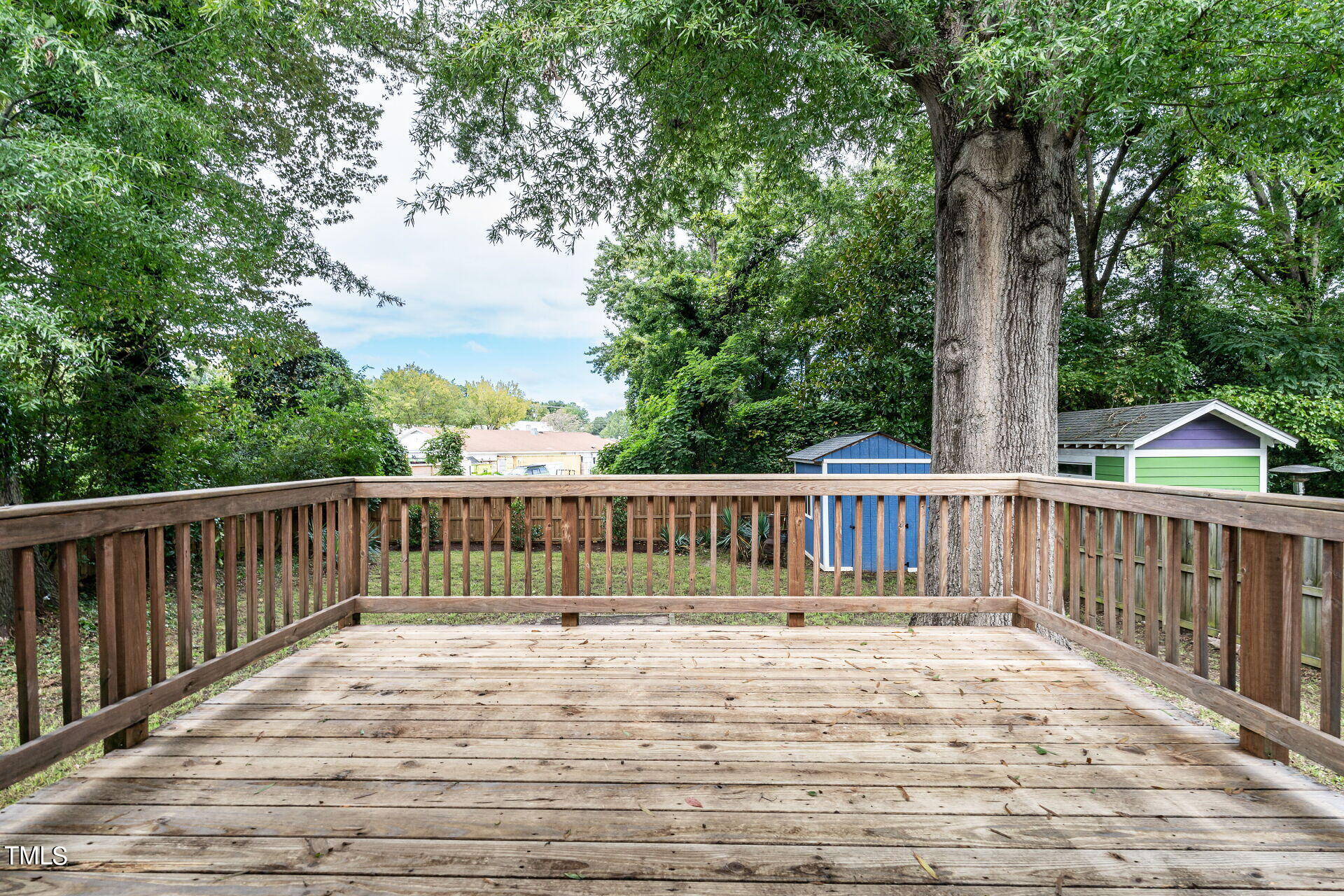 116 Plainview Avenue Raleigh, NC 27604 - Photo 7 of 35 a balcony with wooden floor and fence