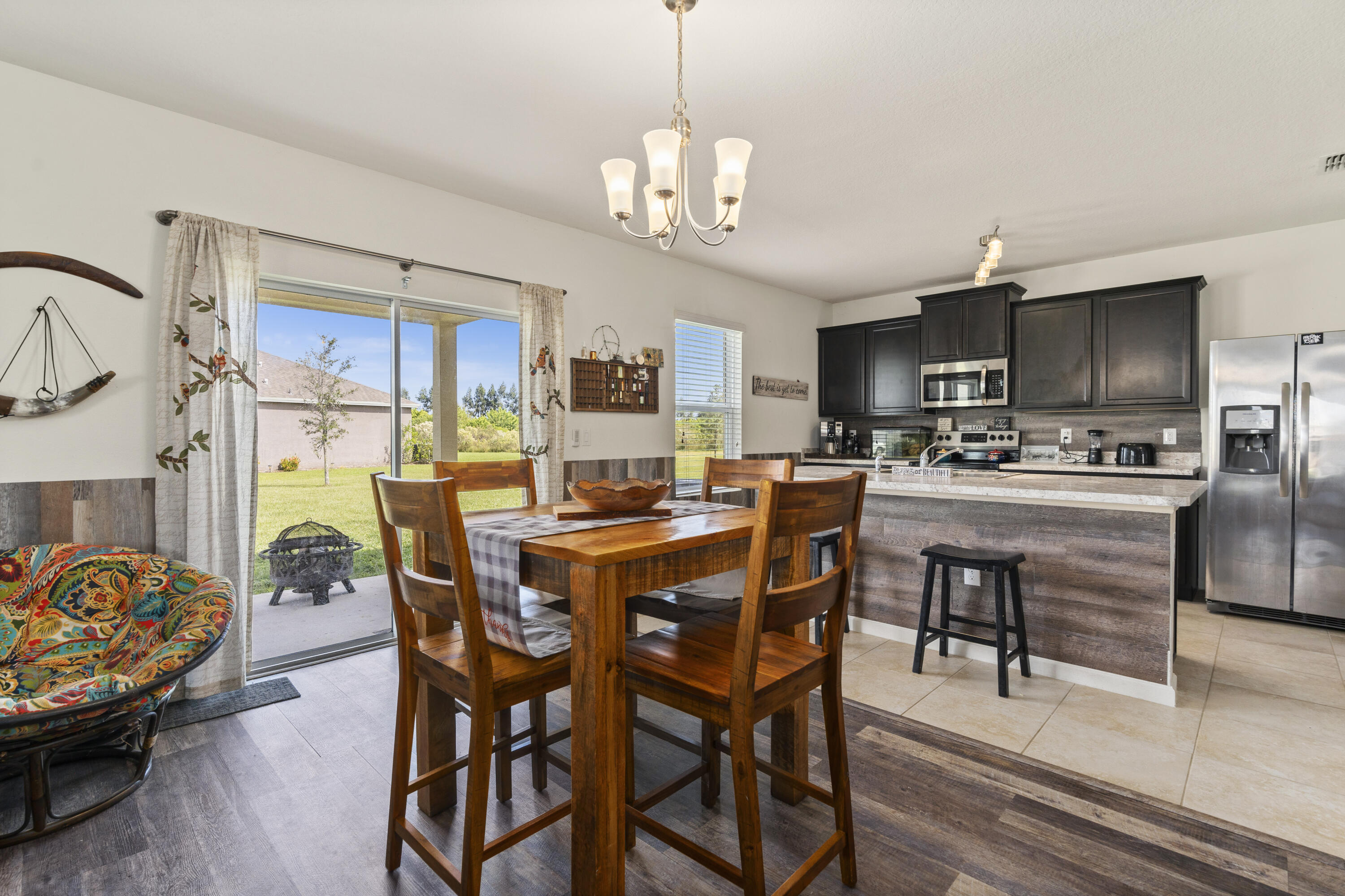 3100 Yellowstone Circle Fort Pierce, FL 34945 - Photo 11 of 28 a view of a dining room with furniture and a chandelier