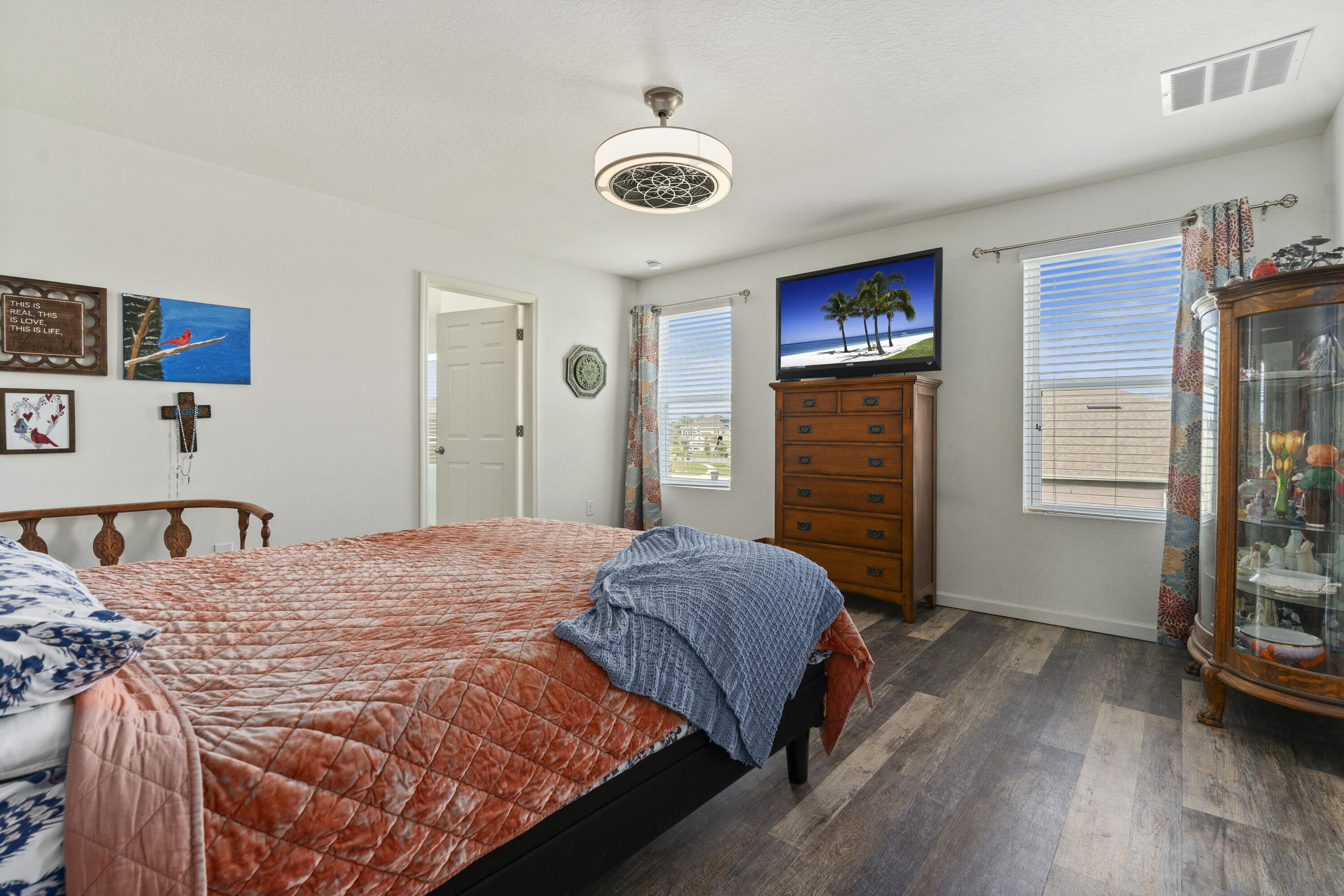 3100 Yellowstone Circle Fort Pierce, FL 34945 - Photo 16 of 28 a bedroom with a bed and a refrigerator