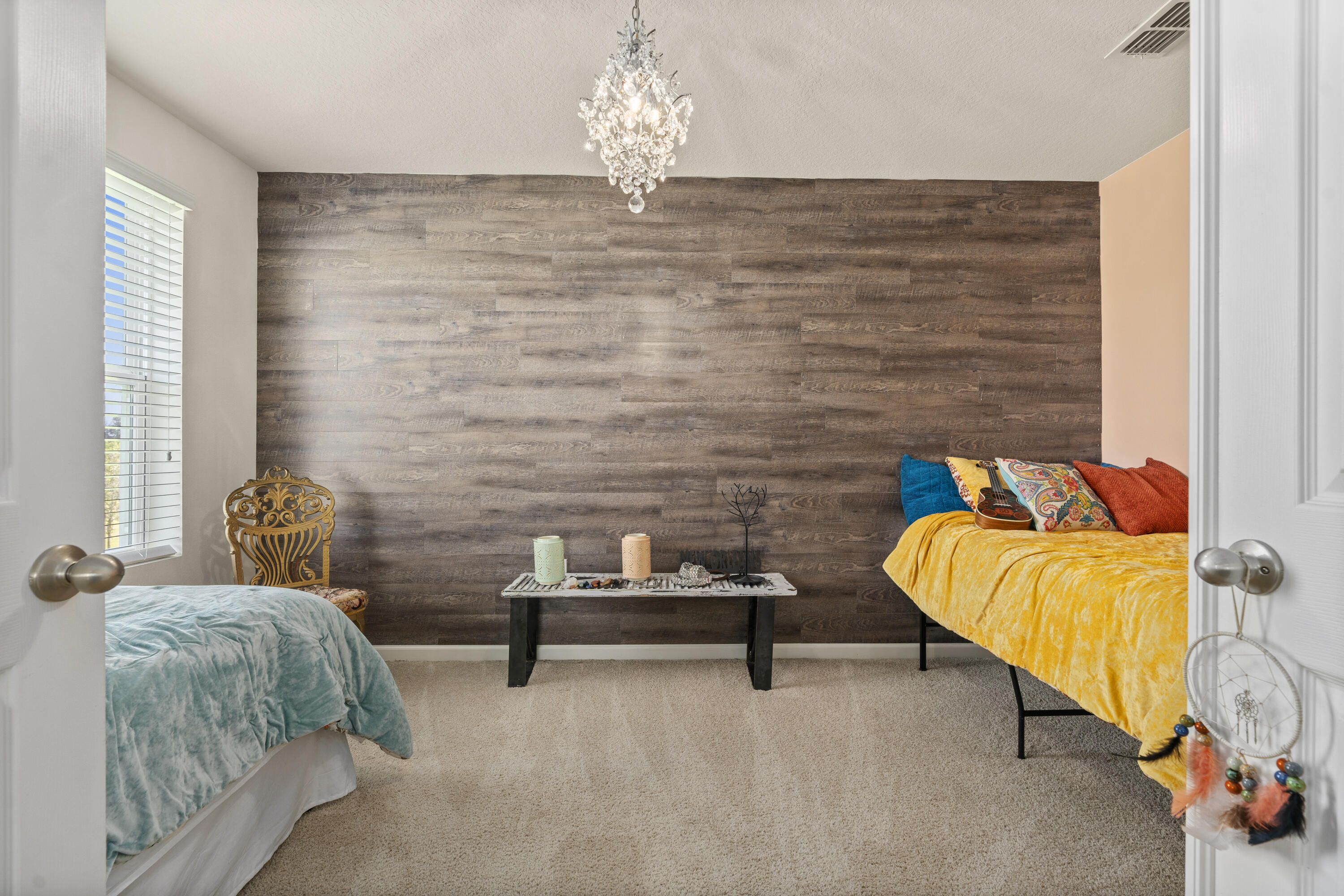 3100 Yellowstone Circle Fort Pierce, FL 34945 - Photo 19 of 28 a bedroom with a bed and a chair