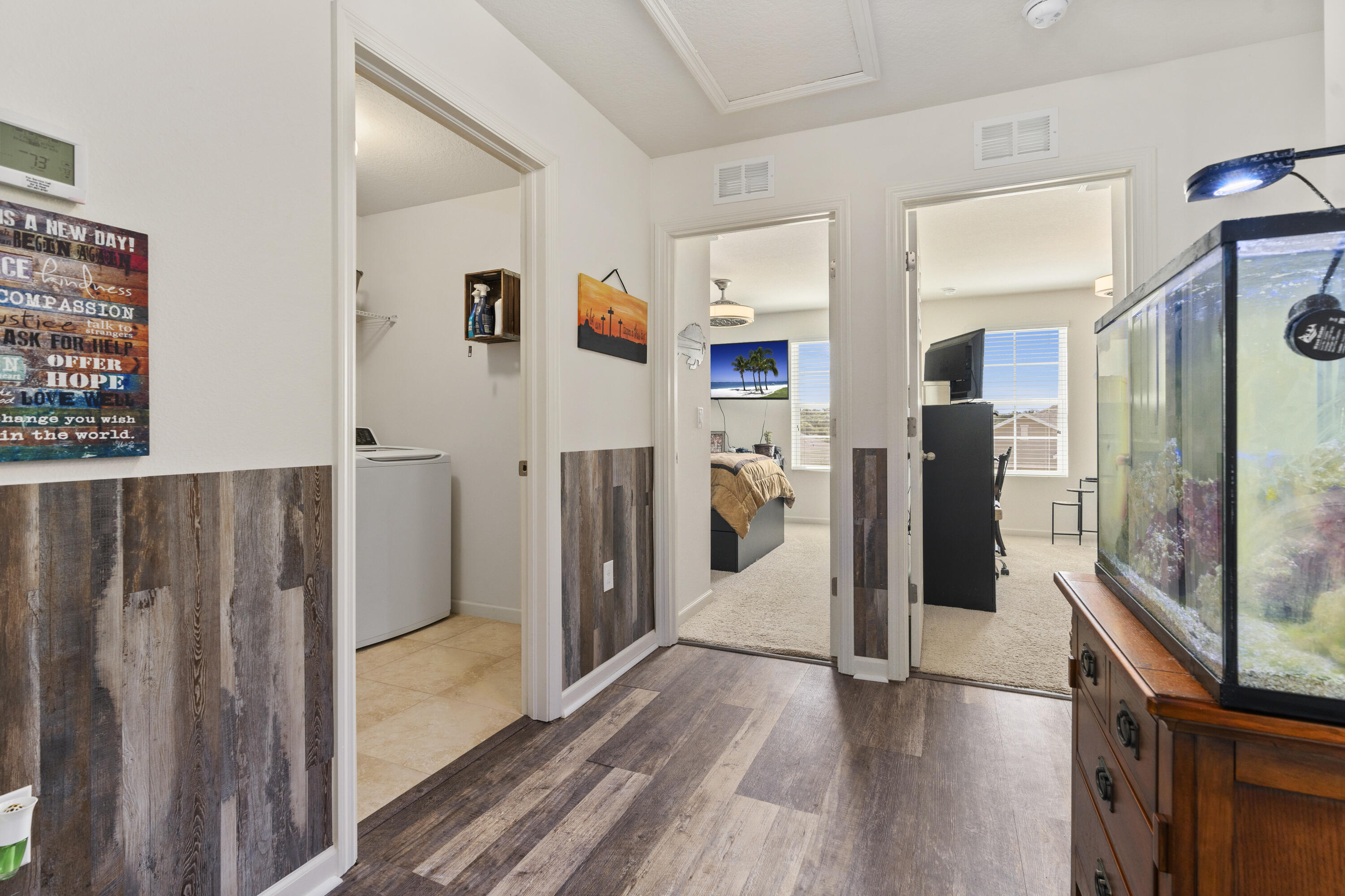 3100 Yellowstone Circle Fort Pierce, FL 34945 - Photo 23 of 28 a view of a kitchen with refrigerator and wooden floor