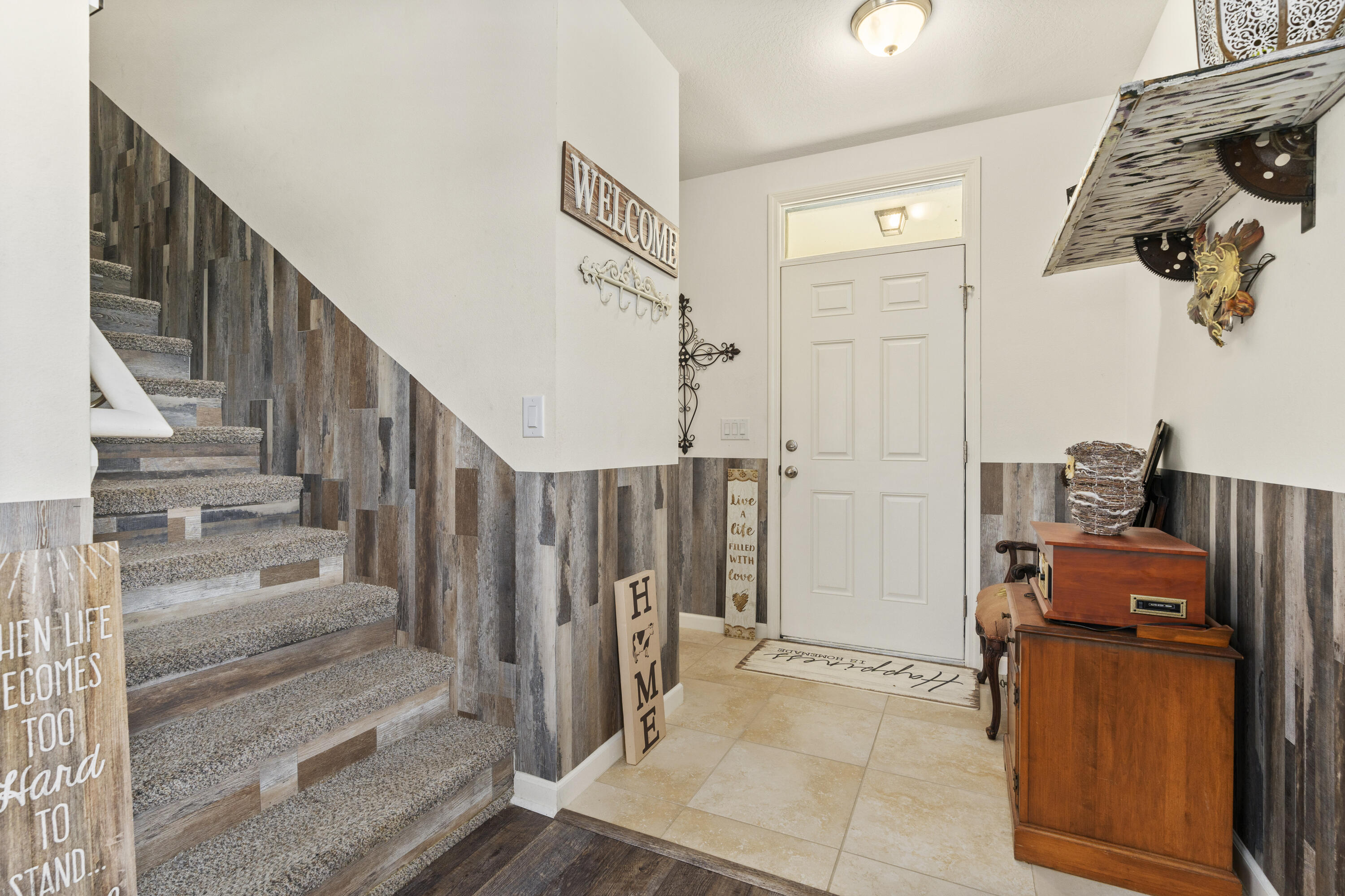 3100 Yellowstone Circle Fort Pierce, FL 34945 - Photo 4 of 28 a view of entryway and hall with wooden floor
